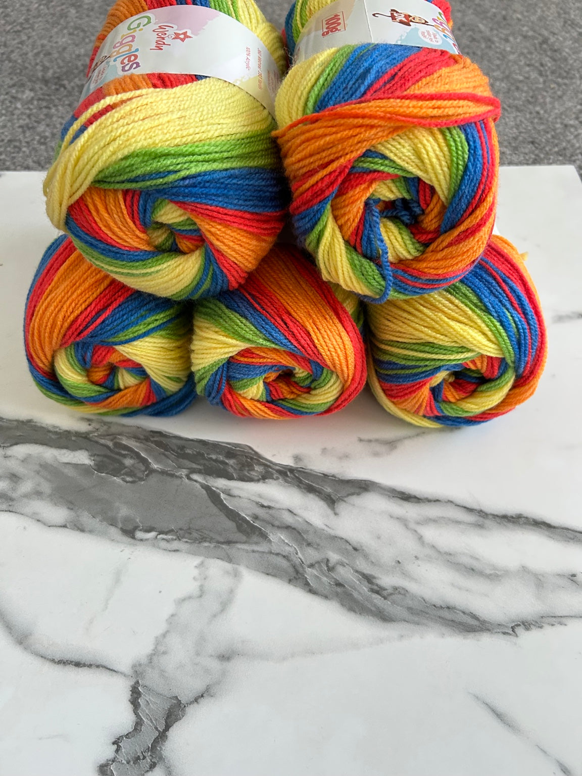Five balls of Wendy Giggles DK WG10 Carnival yarn